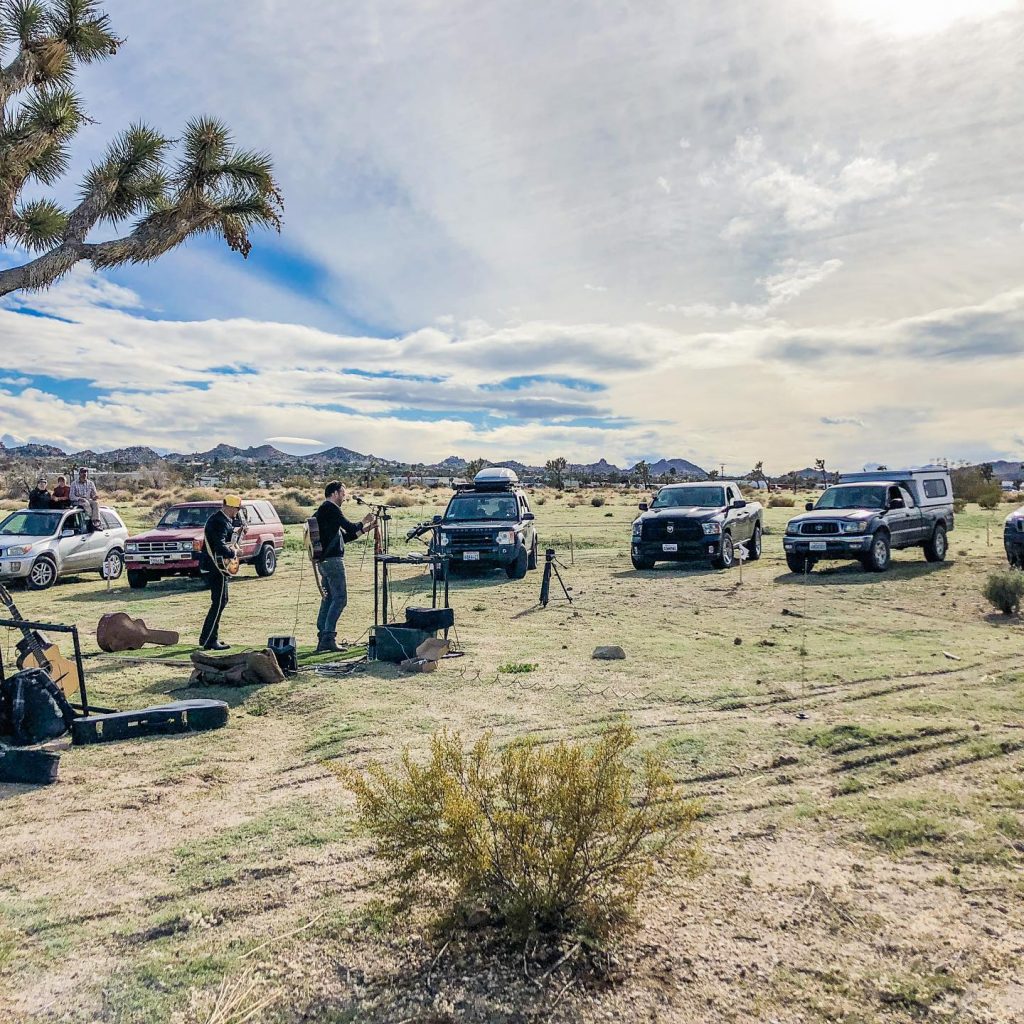 cars surround the Joshua Tree at our first drive-in concert 